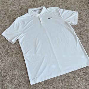 Men’s Nike white DRI-FIT short sleeve golf shirt.